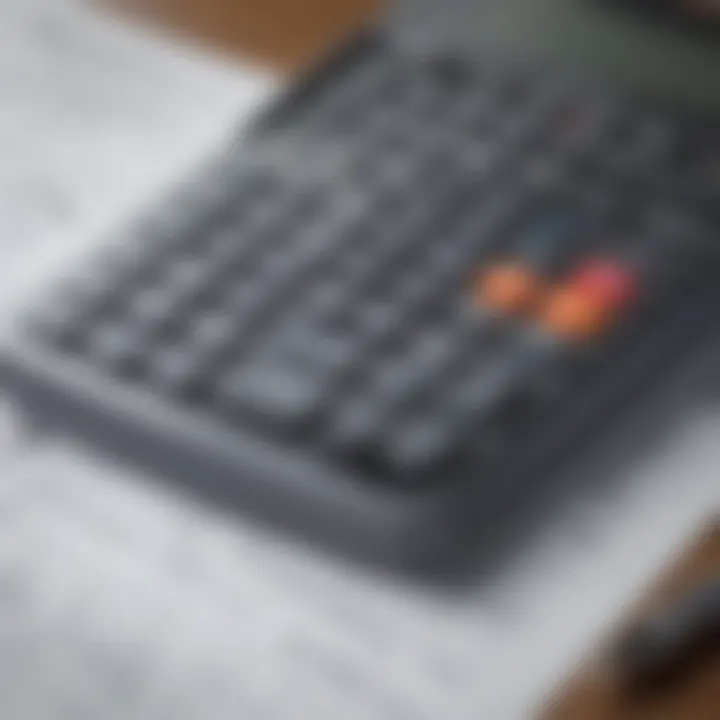 Close-up of a financial calculator with charts and documents