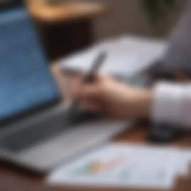 A person analyzing financial statements on a laptop